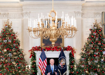 ‘We’re Still in It’: Biden Urges Calm as He Steps Up Omicron Fight
