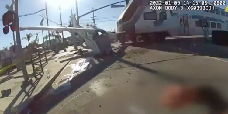 Crashed Pilot Is Pulled to Safety Seconds Before Train Plows Through Crashed Pilot Is Pulled to Safety Seconds Before Train Plows Through