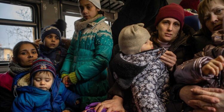 12 hours on board a packed train out of Ukraine
