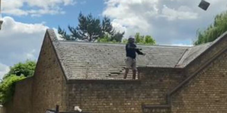 London news: Major police standoff as man throws TILES off roof in bizarre 6.5 hour drama | UK | News London news: Major police standoff as man throws TILES off roof in bizarre 6.5 hour drama | UK | News
