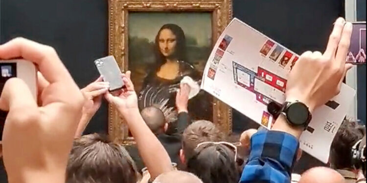 Man Throws Pastry at Mona Lisa, Smearing Cream on Glass Case