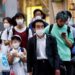 Japan mulls letting asymptomatic COVID patients venture out with masks