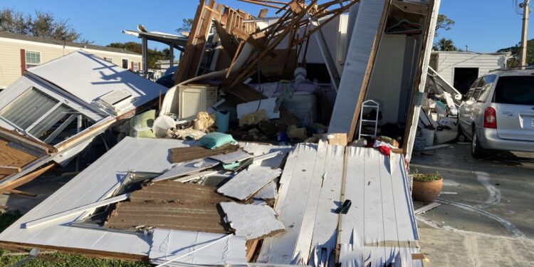 People assess mobile home damage in North Fort Myers People assess mobile home damage in North Fort Myers