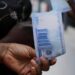 Nigerian naira drops to record low on official market, forwards ease