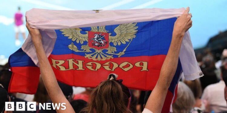 Australian Open bans Russian and Belarusian flags from tournament – BBC
