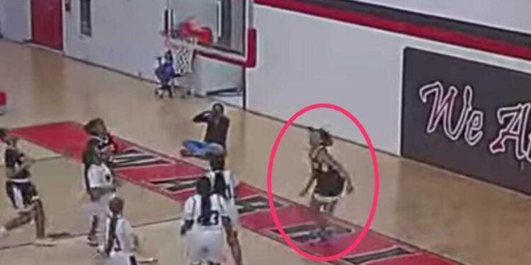 A 22-year-old assistant basketball coach is accused of posing as a teenage girl during a junior varsity game